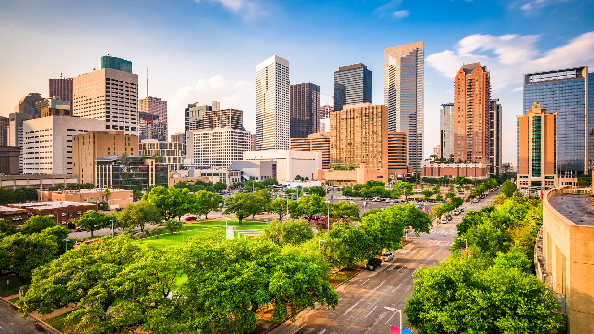 Houston, Texas skyline with downtown skyscrapers and green space in the foreground